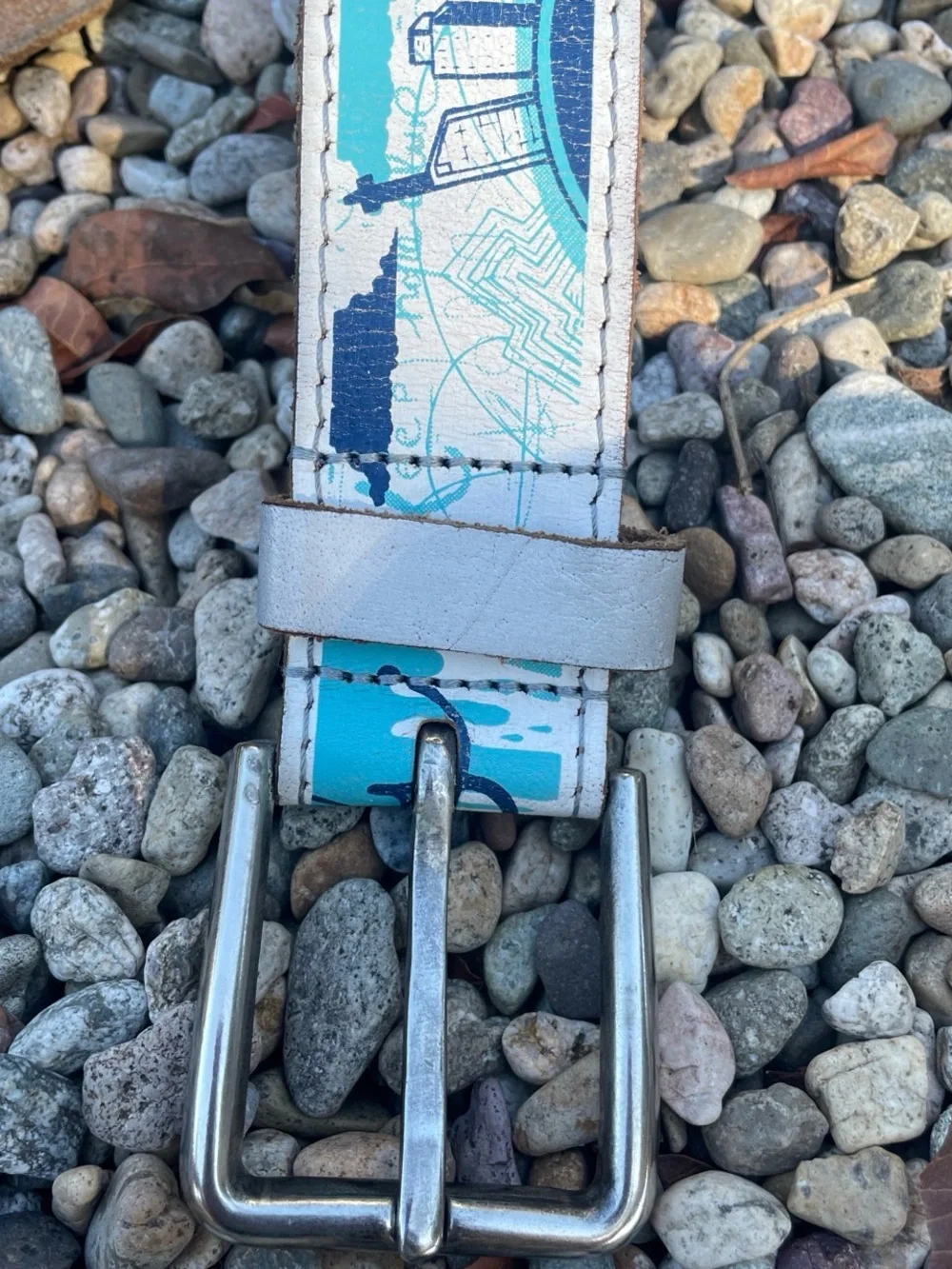 Vintage 80s blue and white FFLY Hope project leather belt with silver buckle.